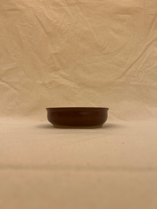 carved plant saucer image 1